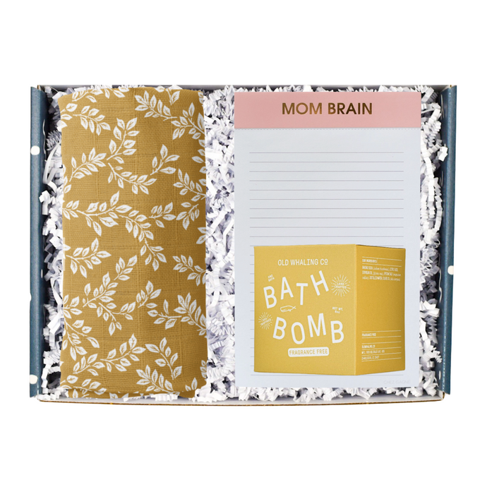 This gift box includes:   Muslin Swaddle (also available in pink & blue) Mom Brain Notepad Bath Bomb Gift Message (you can enter the message at checkout)